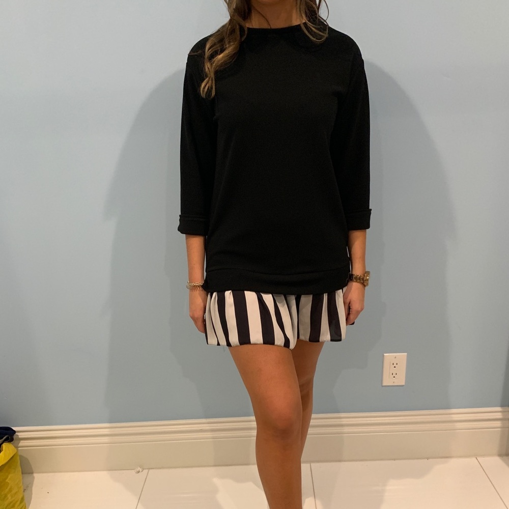 Flowy back dress with striped detailing.